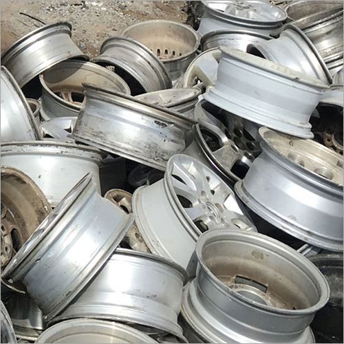 Pile of scrap aluminium alloy wheels for recycling